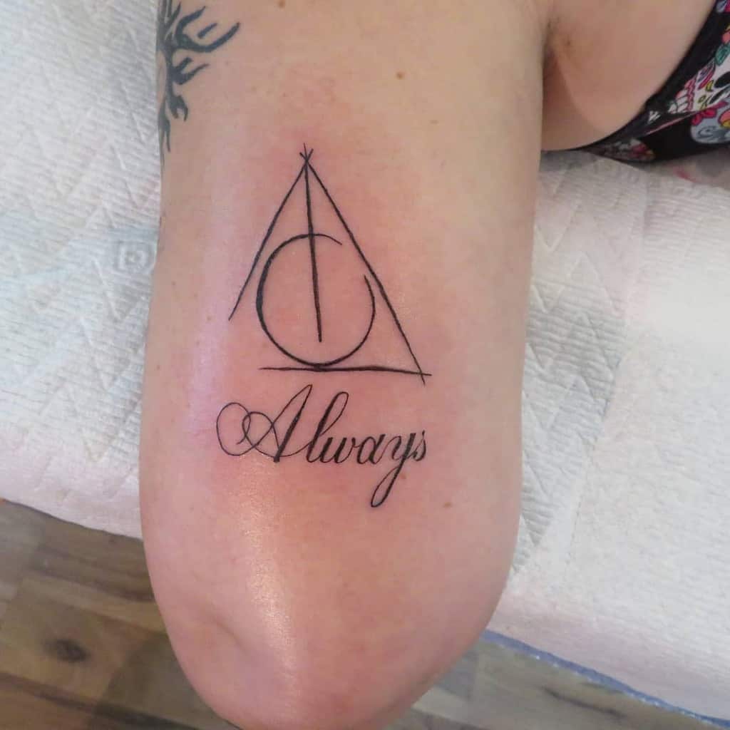 Harry Potter-inspired tattoo featuring the Deathly Hallows symbol and 'Always' in elegant cursive, symbolizing eternal love