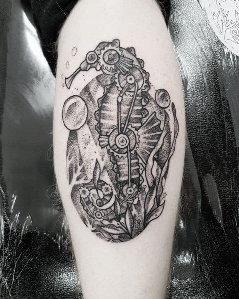Steampunk seahorse tattoo on leg, featuring intricate gears, mechanical elements, and fine dot work shading for a detailed and futuristic design.