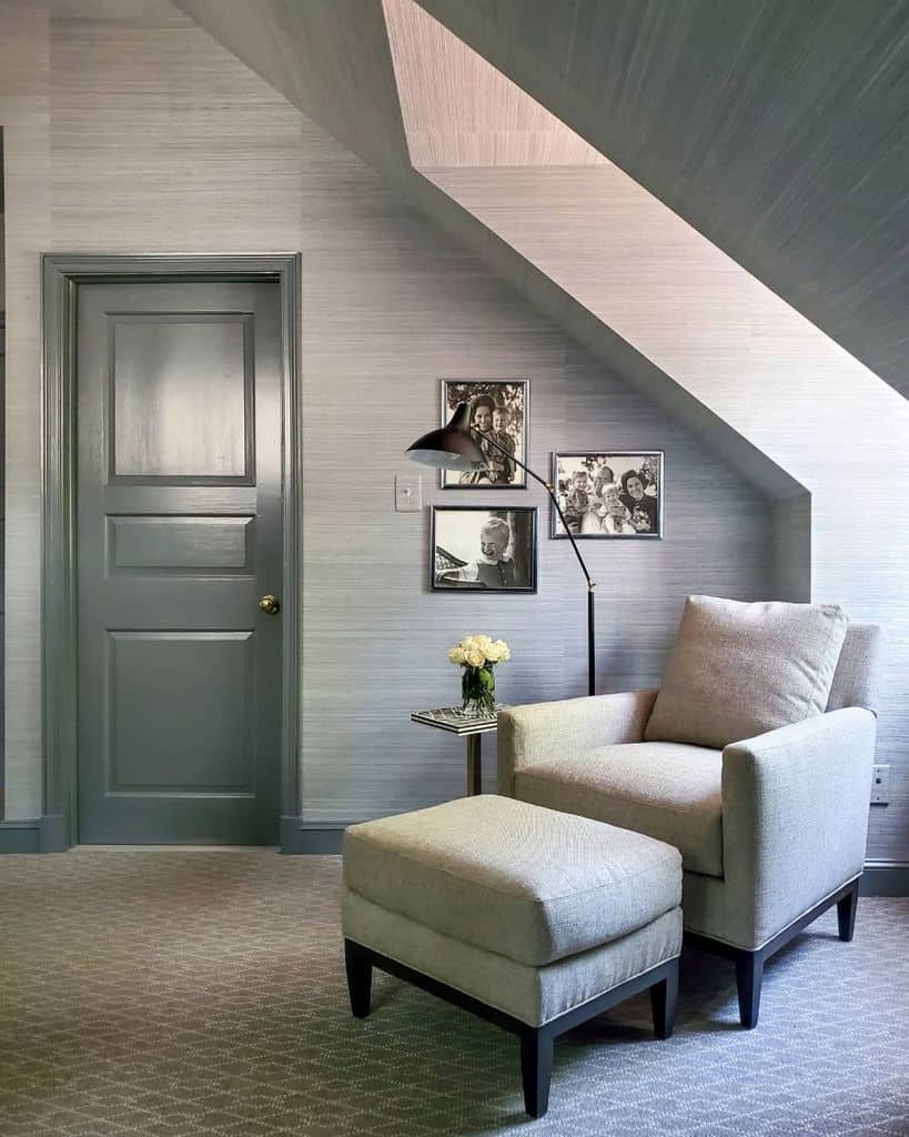 attic living space gray chair with footstool photo wall art