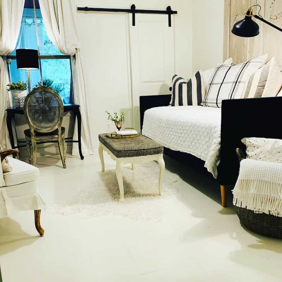 small living room white sliding barn door ottoman couch vintage chair and table set