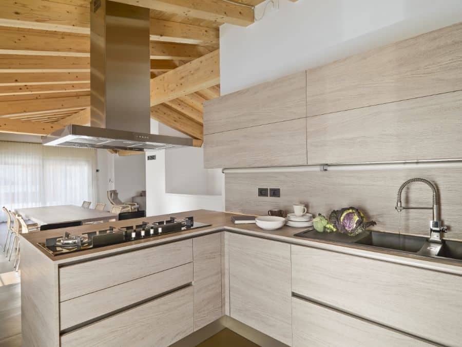 open kitchen with exposed ceiling beams