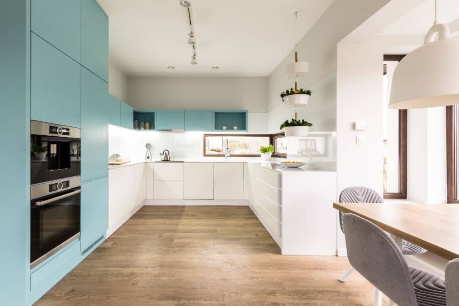 blue and white cabinet kitchen with wood vinyl flooring