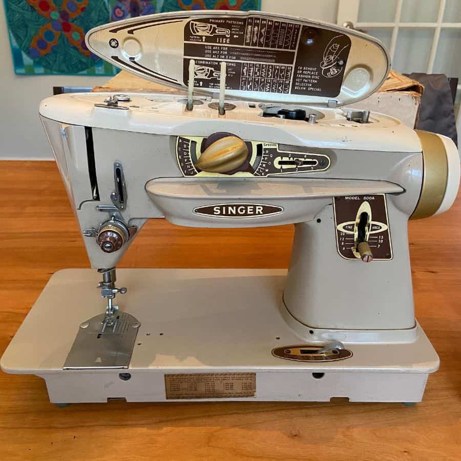Vintage Singer sewing machine on a wooden table