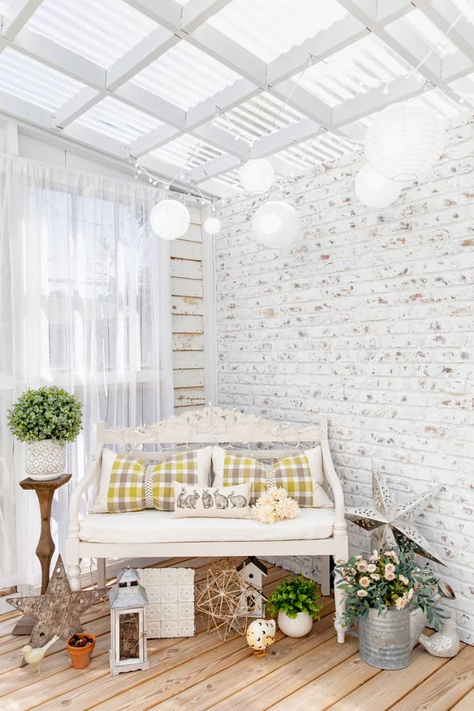 white brick wall she said with bench 