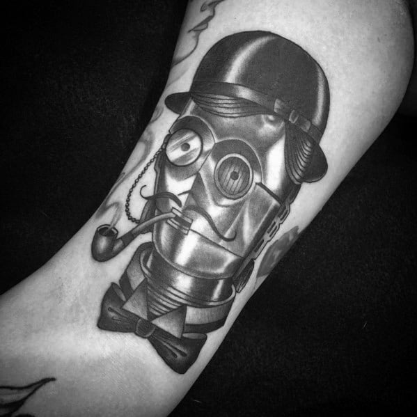Vintage-style C-3PO tattoo with a monocle, bowler hat, bow tie, and pipe, blending steampunk aesthetics with a classic gentlemanly look.