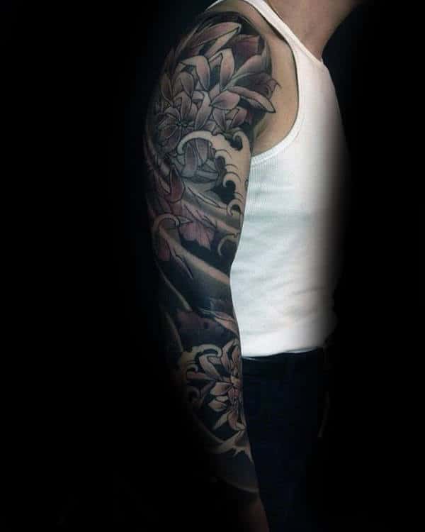 Shaded Black And Grey Chrysanthemum Flower With Ocean Water Waves Male Japanese Sleeve Tattoo
