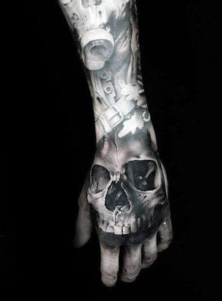 Shaded Black And Grey Cool Skull Tattoo On Mans Hand