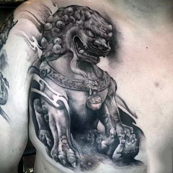 Shaded Black And Grey Ink Statue Tattoo Of Foo Dog On Man