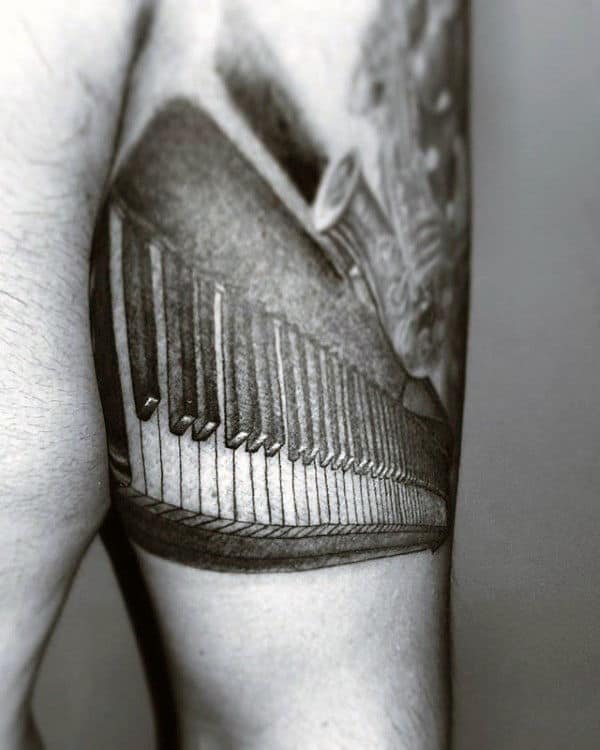 Shaded Black And Grey Male Piano Tricep Tattoo