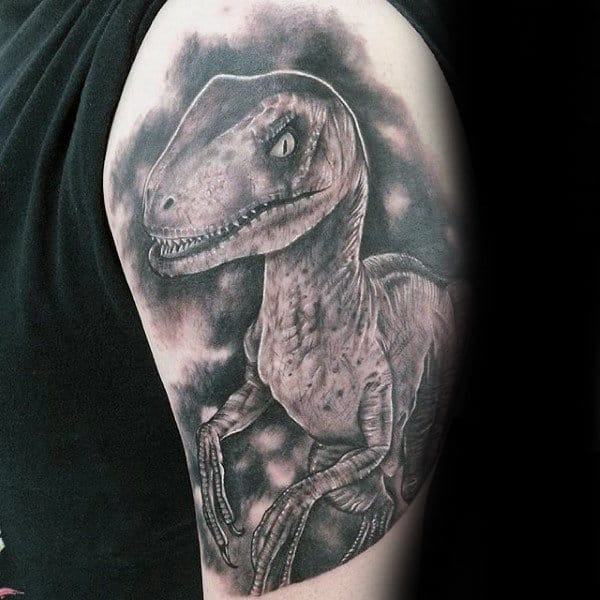 Shaded Black And Grey Male Velociraptor Tattoo Design On Arm