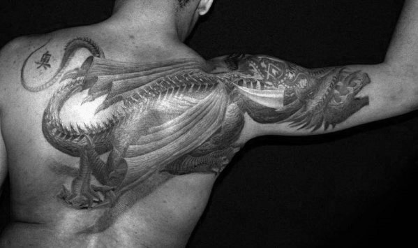Shaded Black And Grey Mens Back Of Shoulder And Arm Dragon Tattoo Designs