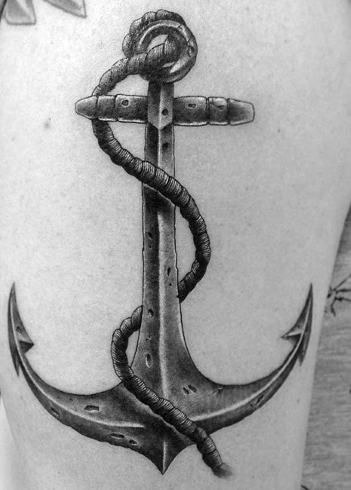 Tattoo of a detailed anchor with a rope wrapped around it on a person's skin