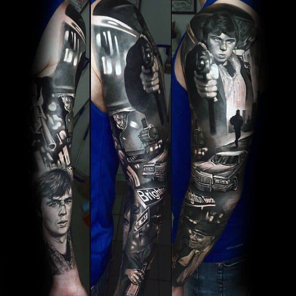 Black and grey full-sleeve tattoo featuring realistic portraits of classic movie characters, dramatic lighting, and detailed cinematic elements.