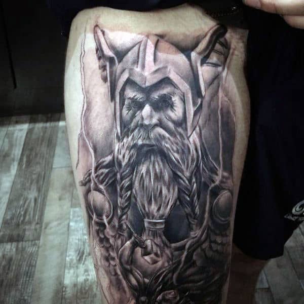 Shaded Black And White Ink Male Odin Tattoo Design On Thighs