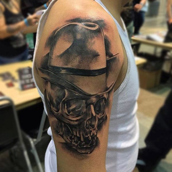 Shaded Black Skull With Cowboy Hat Bicep Tattoo For Men