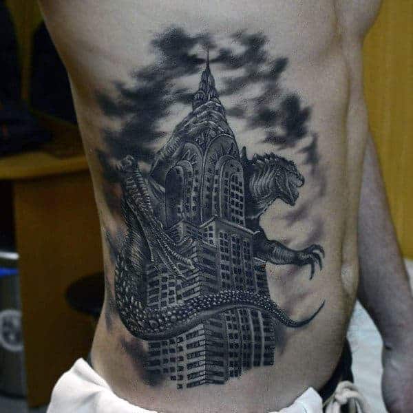 shaded-blackwork-tattoo-of-godzilla-crushing-skyscraper-on-mans-side