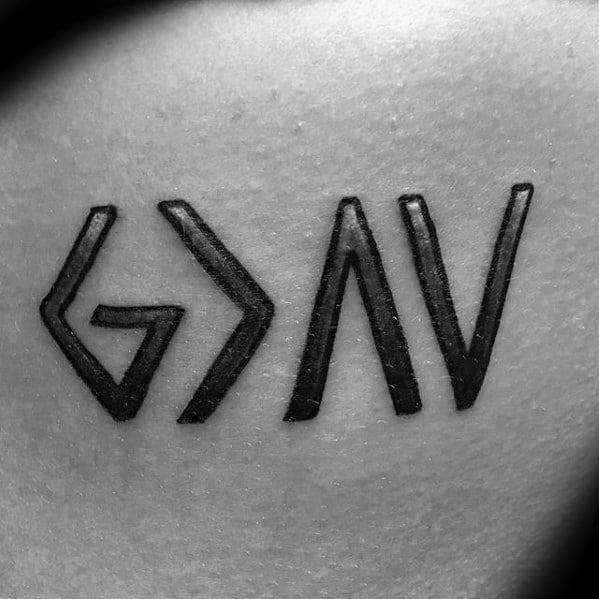 Close-up tattoo featuring "God is greater than the highs and lows" symbol in bold black ink and minimalist design
