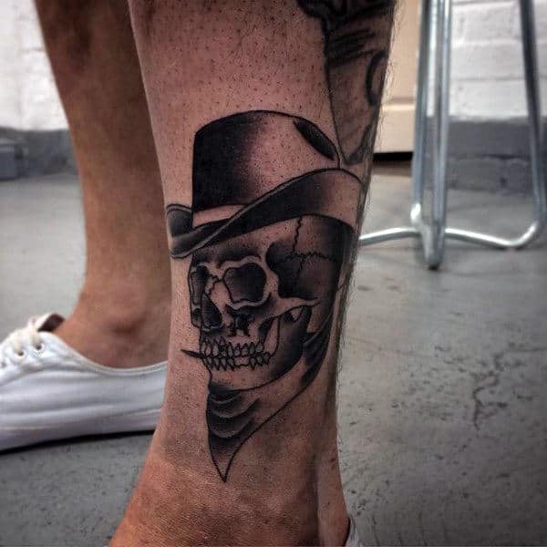 Shaded Cowboy Skeleton Smoking Tattoo On Mans Ankle