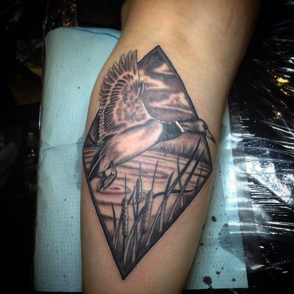 Shaded Diamond Tattoo With Mallard Taking Flight On Male