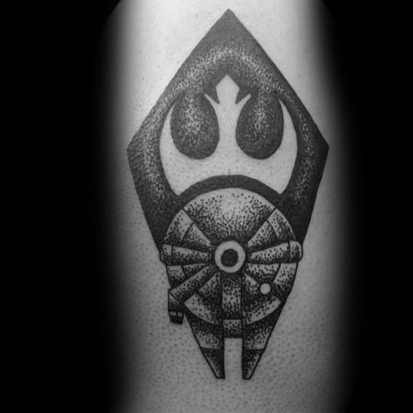 Tattoo featuring a spaceship and emblem with geometric shapes in black ink