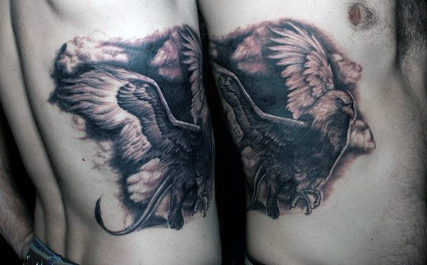 Shaded Flying Griffin Guys Rib Cage Side Black And Grey Tattoo Design