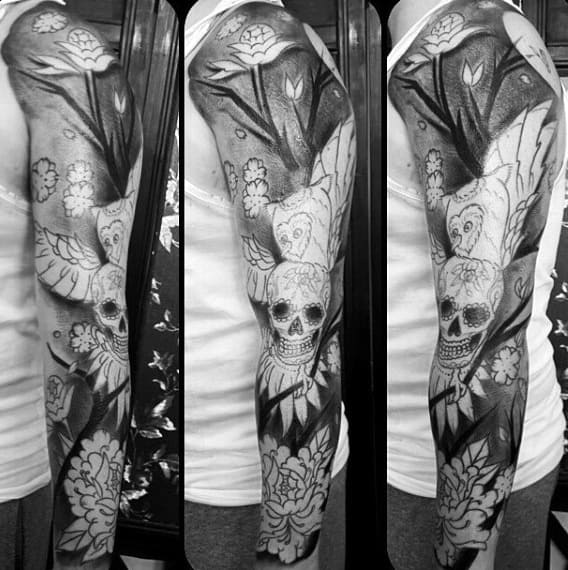 Shaded Full Sleeve Peony Flower Tattoo On Man With Owl In Forest And Skull Design