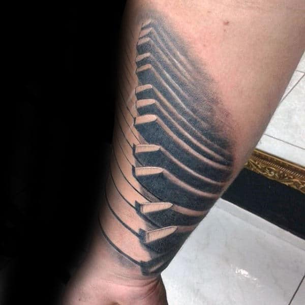Shaded Grey Ink Male Tattoo Of Piano Keys On Forearms