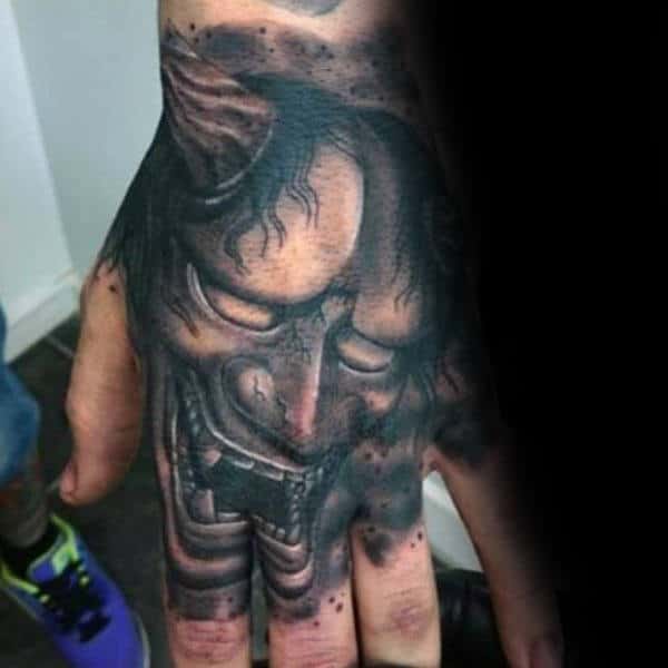 Shaded Hannya Mask Hand Tattoo Inspiration For Men