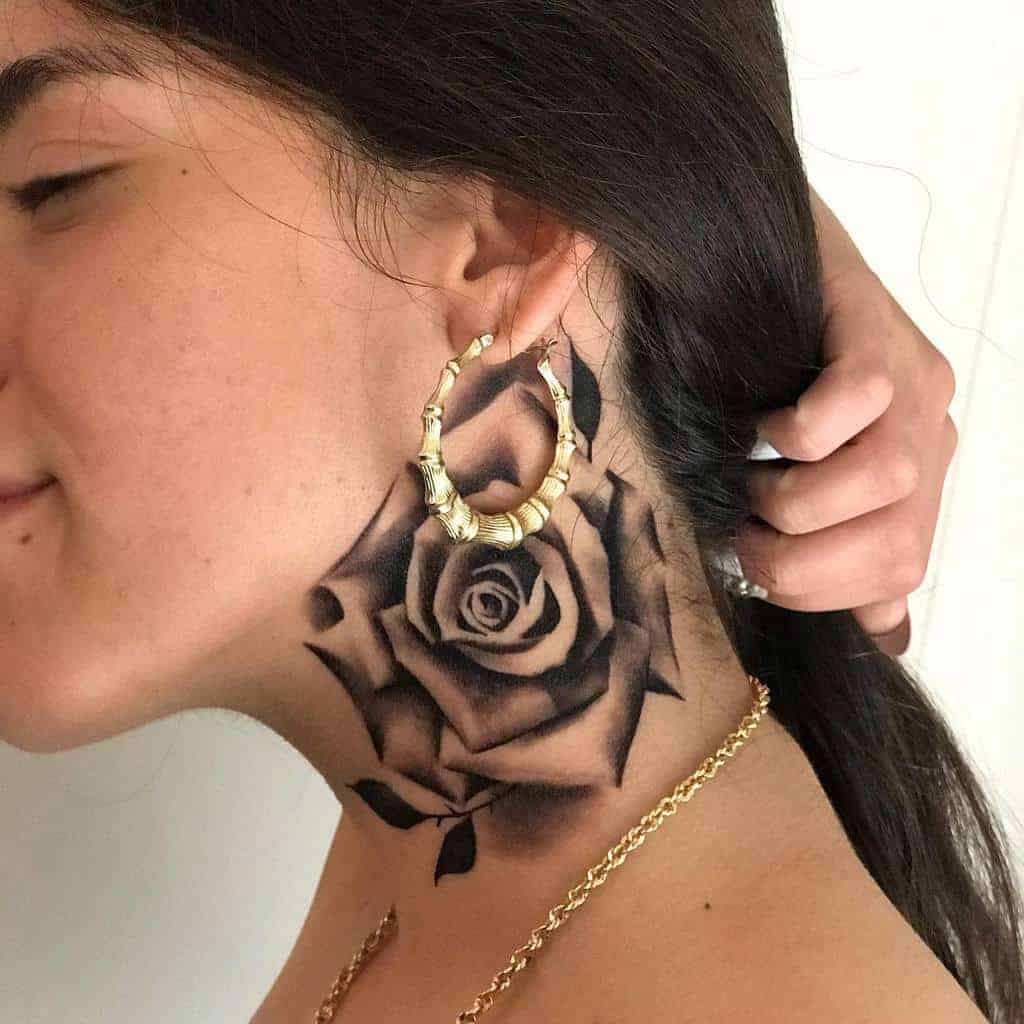 Woman with a black rose neck tattoo
