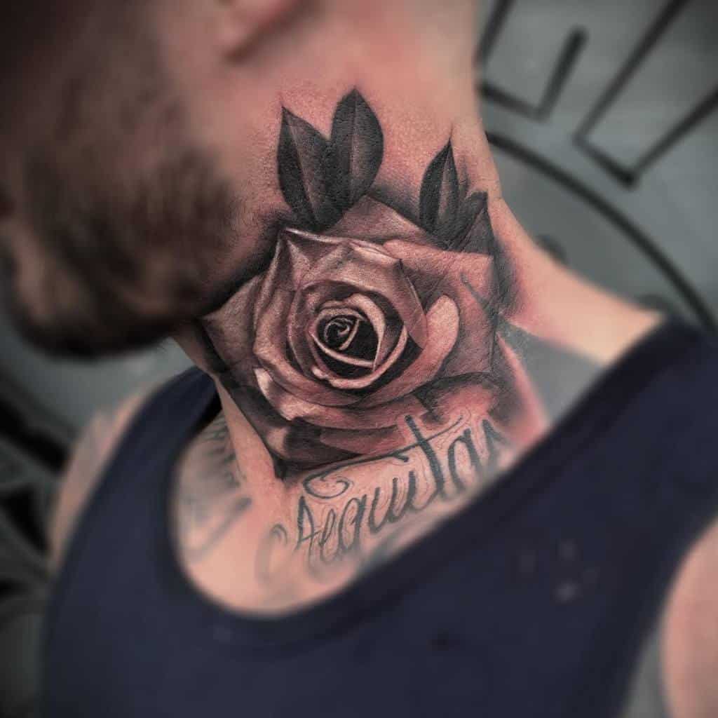 Bold black and grey rose tattoo on the neck with detailed shading, accompanied by script lettering beneath the flower