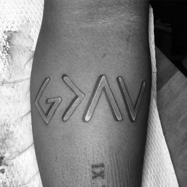 Tattoo featuring "God is greater than the highs and lows" symbol in bold raised design for a 3D effect
