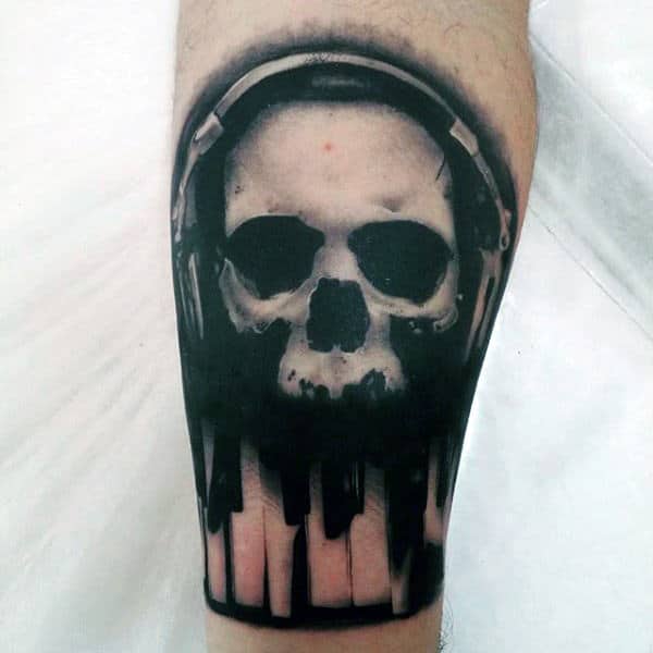 Shaded White Ink Skull With Headphones And Piano Keys Mens Leg Tattoos