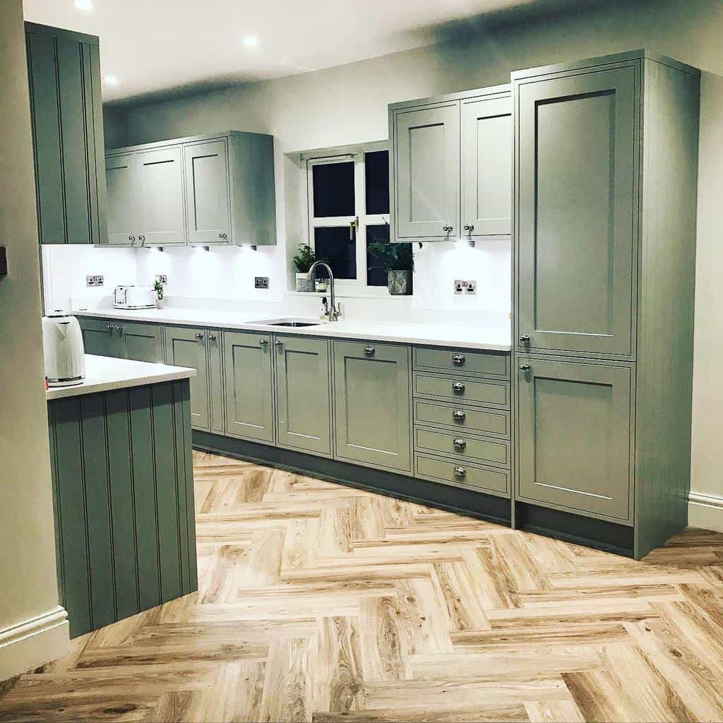 large modern shaker galley kitchen green cabinets white countertops subway vinyl flooring