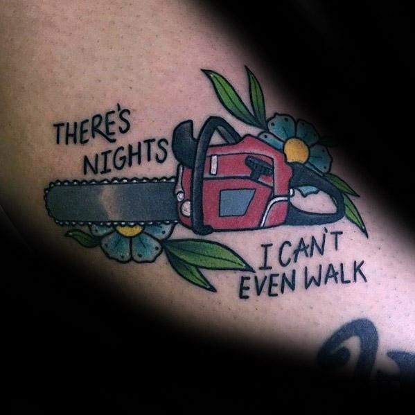 Traditional-style tattoo of a red chainsaw with flowers and the phrase “There’s nights I can’t even walk,” combining pain and beauty.