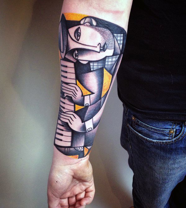 Cubist forearm tattoo of a pianist in abstract style, featuring angular forms, soft shading, and bold yellow accents for a modern artistic look.