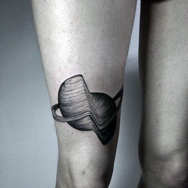 Glitch tattoo of a planet with rings, featuring a warped and distorted shape that creates a flowing, digital-wave illusion on the leg