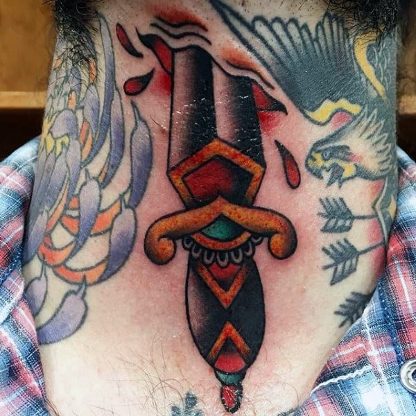 Bold traditional throat tattoo of a dagger piercing the skin, with red accents and surrounding designs of an eagle and arrows