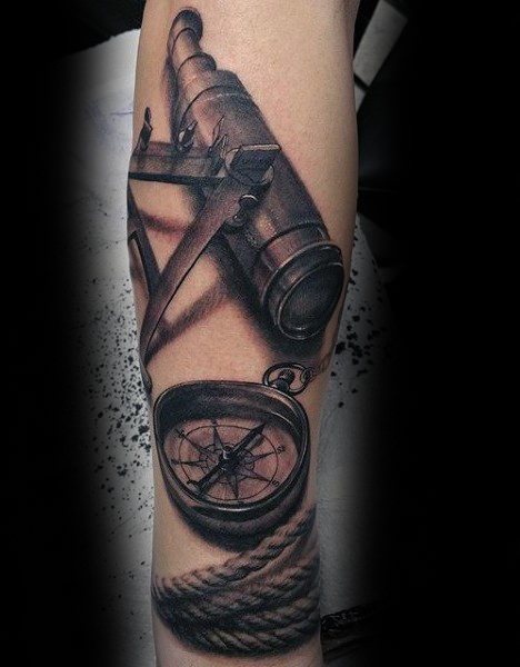 Tattoo of a sextant, compass, rope, and telescope on a person's arm