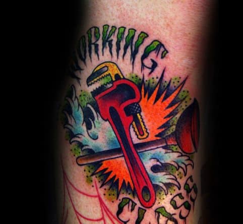 Bold and colorful tattoo featuring a red pipe wrench and plunger crossed over water splashes and bursts, with WORKING CLASS text above and below.