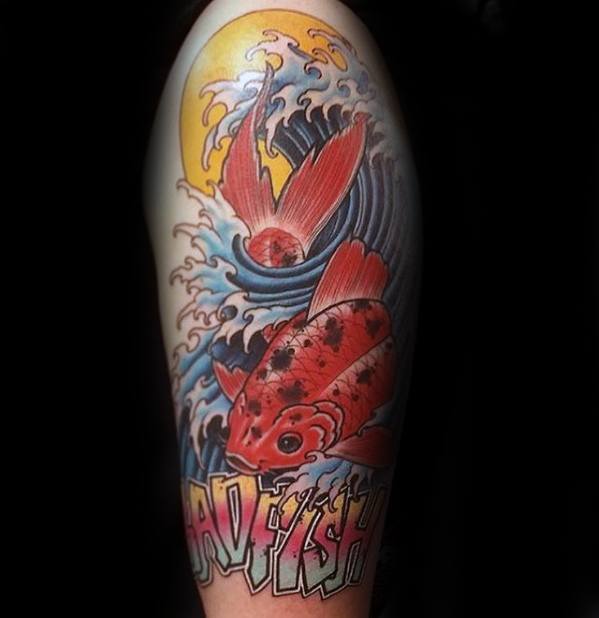 Colorful leg tattoo of a koi fish leaping through ocean waves under the sun, with bold “Badfish” lettering at the bottom.