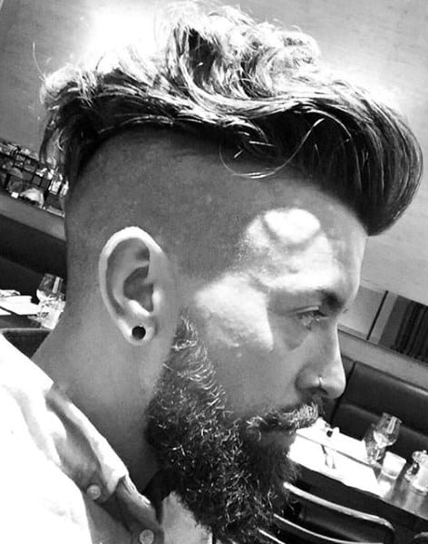 Shaved Sides Undercut Mens Wavy Haircut With Beard
