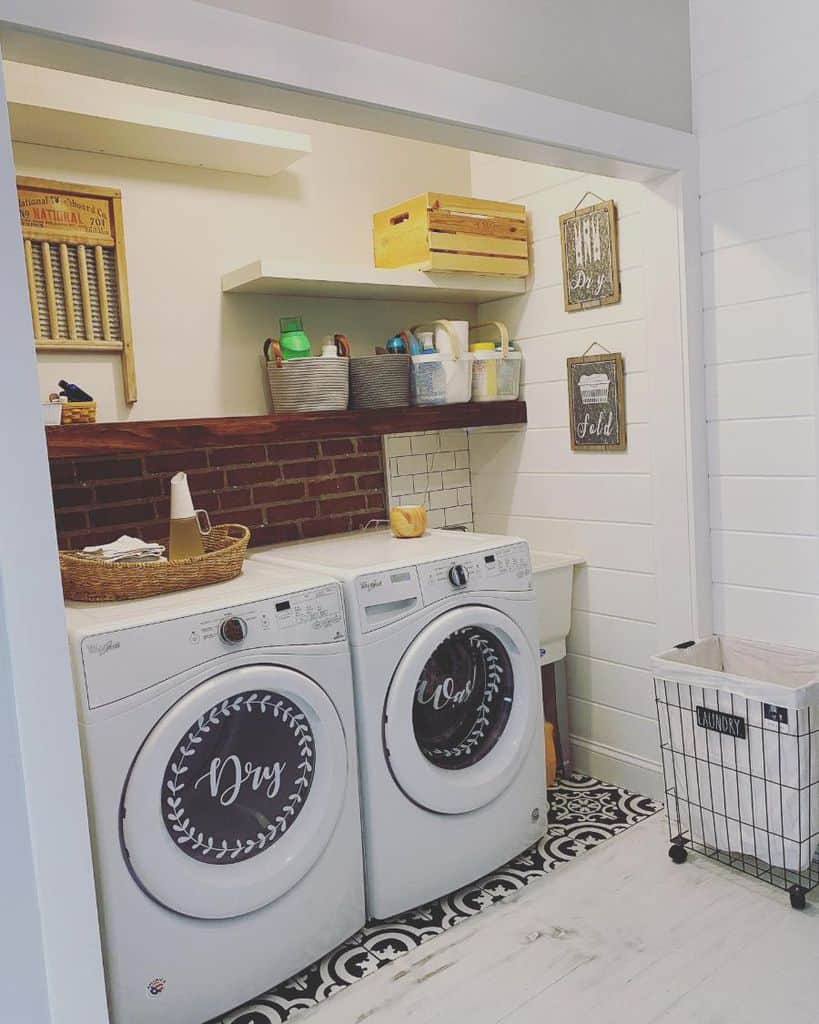 floating wood shelving laundry unit exposed brick wall 