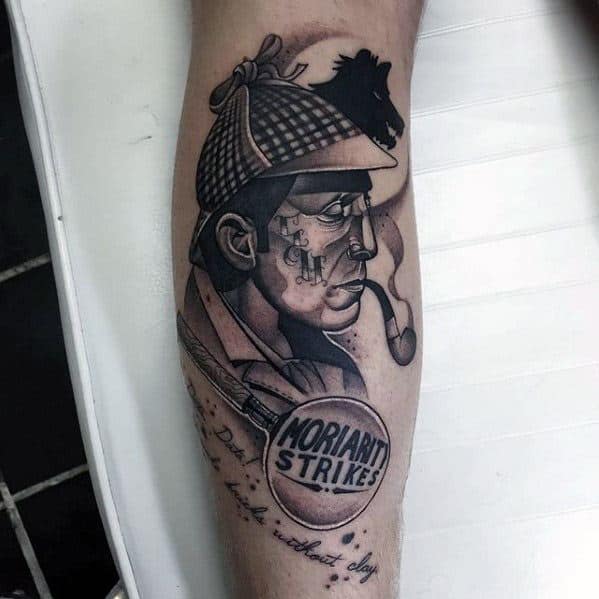 Tattoo of Sherlock Holmes with a pipe, clock, and "MORIARTI STRIKES" text on a person's leg