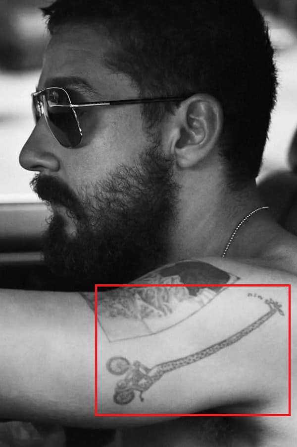 Whistling Giraffe Riding a Bike Tattoo