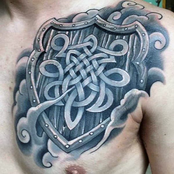 Shield With Celtic Knots And Clouds Mens Upper Chest Tattoos