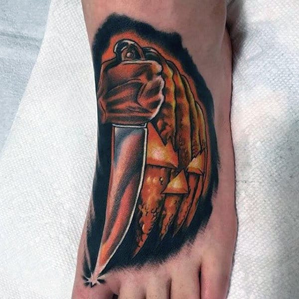 Shining Metallic Brown Knife Tattoo On Foot