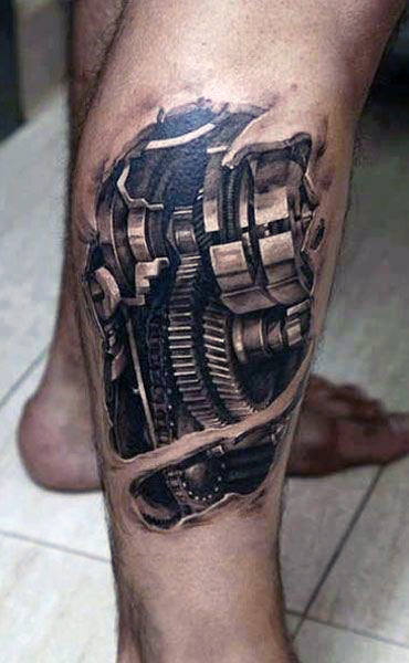 Leg tattoo resembling mechanical gears and components