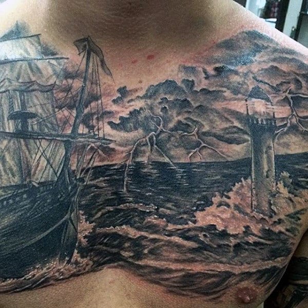 Ship With Thunder Lighthouse Tattoo On Mans Chest