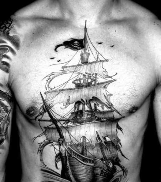Ship With Torn Pirate Flags Mens Chest Tattoos
