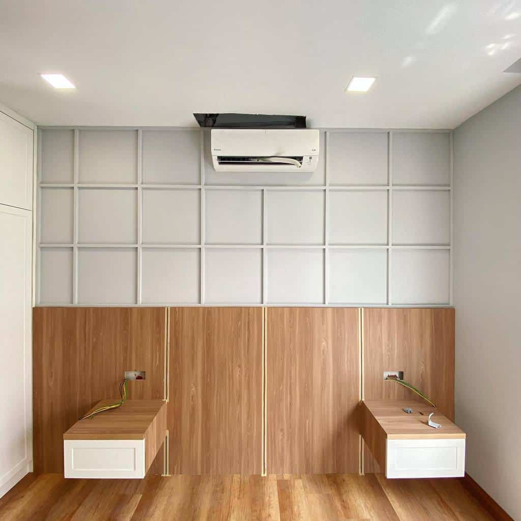 Empty room with black vertical shiplap accent wall and carpeted floor.